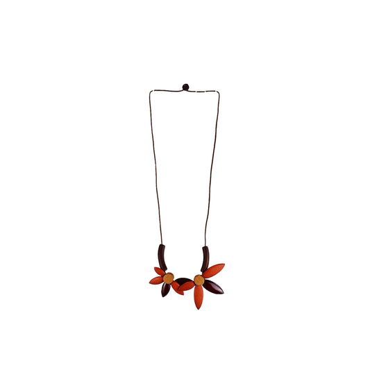 handmade wooden necklace featuring a floral pendant in orange. A unique, eco-friendly artisan-crafted jewelry piece made from sustainable wood, inspired by nature.

