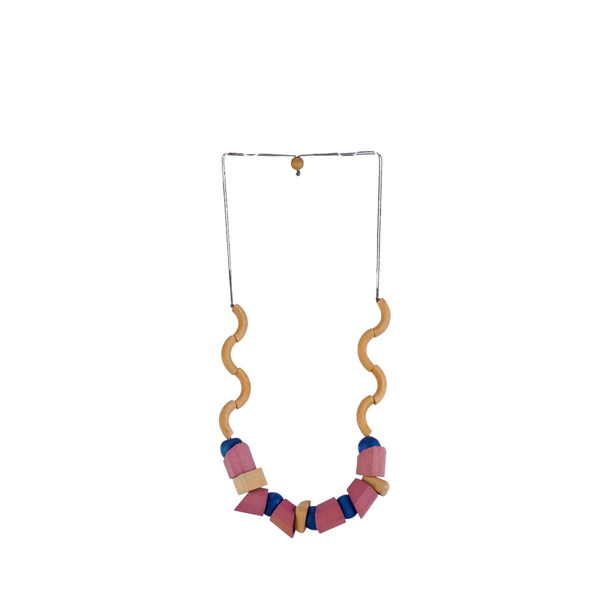 Handmade wooden necklace featuring mixed shaped pink beads in a wavy design. A unique, eco-friendly, artisan-crafted jewelry piece inspired by nature.
